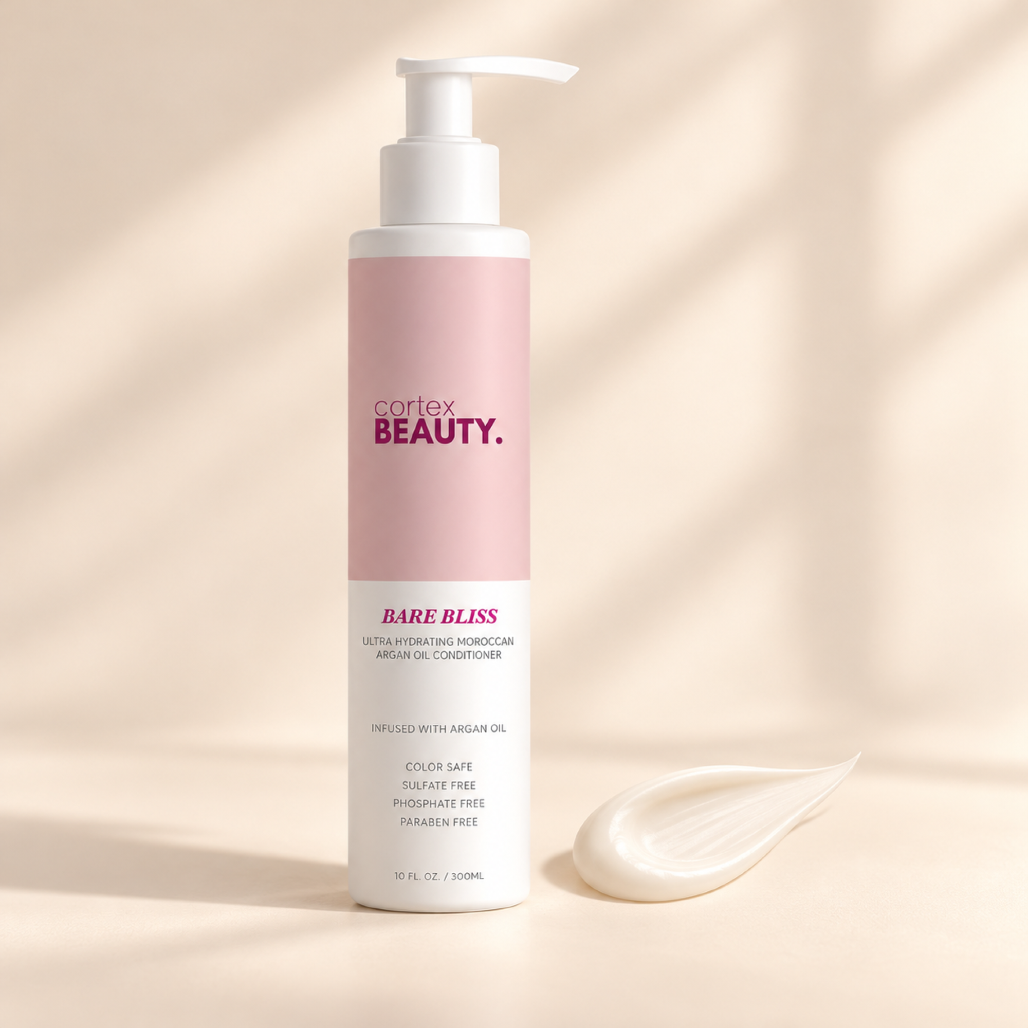 Bare Bliss | Hydrating Moroccan Argan Oil Conditioner | 10 oz with a formula texture swatch on a cream surface