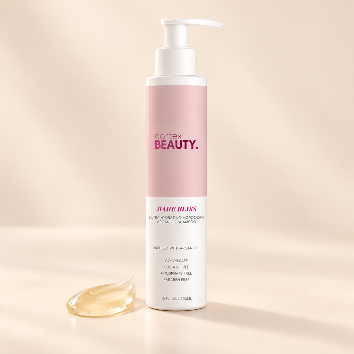 Bare Bliss | Hydrating Moroccan Argan Oil Shampoo | 10 oz with a formula texture swatch on a cream surface